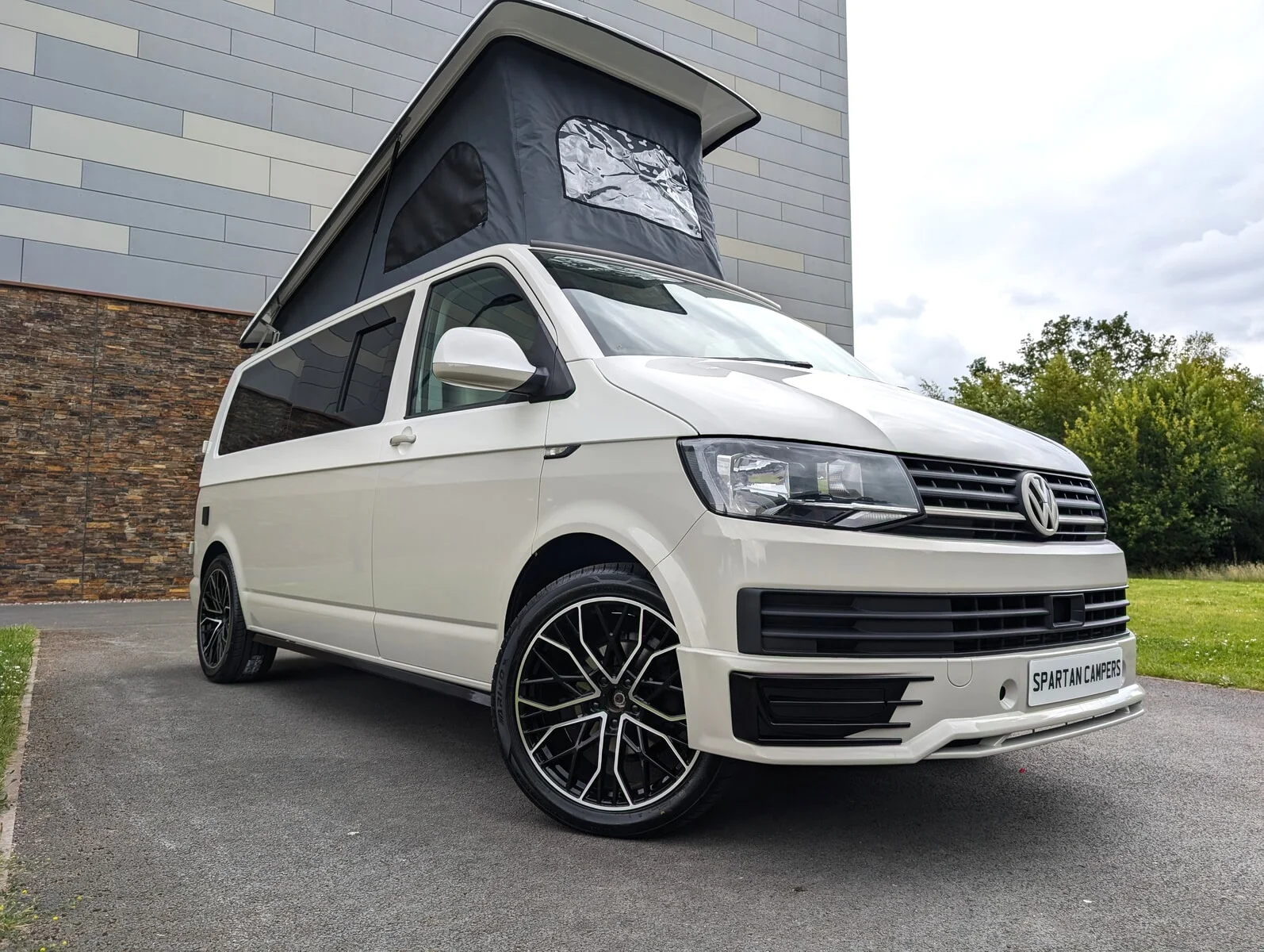2018 VW T6 Spartan Conversion in two-tone Candy White and Ascot Grey, DSG automatic, parked on display.