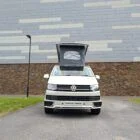 2018 VW T6 Spartan Conversion in two-tone Candy White and Ascot Grey, DSG automatic, parked on display.