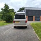 2018 VW T6 Spartan Conversion in two-tone Candy White and Ascot Grey, DSG automatic, parked on display.