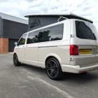 2018 VW T6 Spartan Conversion in two-tone Candy White and Ascot Grey, DSG automatic, parked on display.