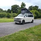 2018 VW T6 Spartan Conversion in two-tone Candy White and Ascot Grey, DSG automatic, parked on display.