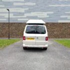 2018 VW T6 Spartan Conversion in two-tone Candy White and Ascot Grey, DSG automatic, parked on display.