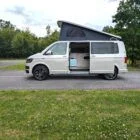 2018 VW T6 Spartan Conversion in two-tone Candy White and Ascot Grey, DSG automatic, parked on display.