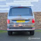 VW T6.1 Transporter in Indium Grey with a Spartan campervan conversion, parked outdoors with clean lines and a practical touring profile.