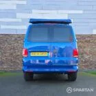 VW T6.1 Transporter in Ravenna Blue, fitted with a Spartan campervan conversion, parked outdoors. Clean lines, factory stance, and upgraded camper profile visible