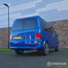 VW T6.1 Transporter in Ravenna Blue, fitted with a Spartan campervan conversion, parked outdoors. Clean lines, factory stance, and upgraded camper profile visible