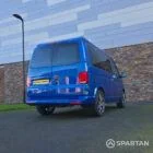 VW T6.1 Transporter in Ravenna Blue, fitted with a Spartan campervan conversion, parked outdoors. Clean lines, factory stance, and upgraded camper profile visible