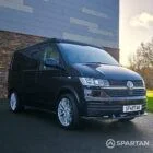 VW T6.1 Transporter campervan in gloss black with a spartan conversion from the front