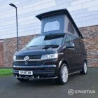 VW T6.1 Transporter campervan in gloss black with a spartan conversion from the front