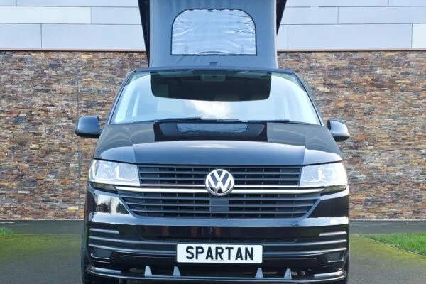 VW T6.1 Transporter campervan in gloss black with a spartan conversion from the front