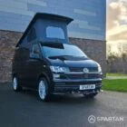 VW T6.1 Transporter campervan in gloss black with a spartan conversion from the front