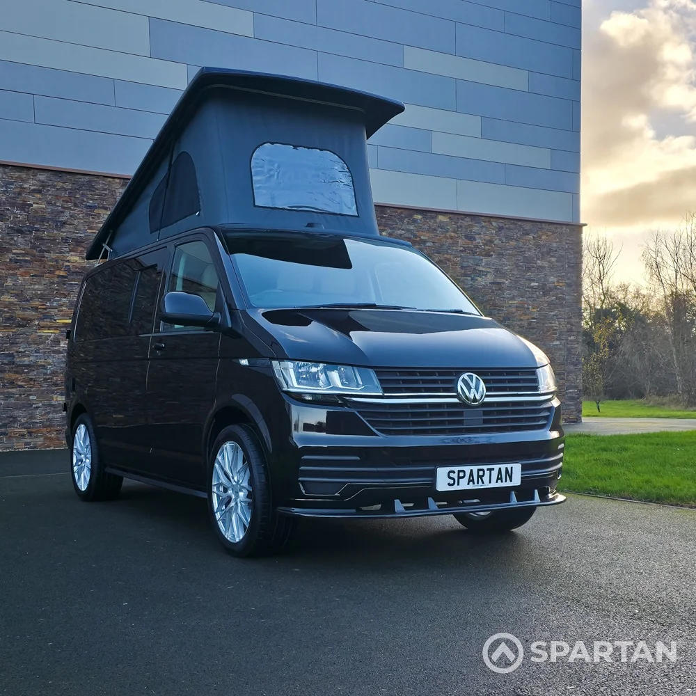 VW T6.1 Transporter campervan in gloss black with a spartan conversion from the front
