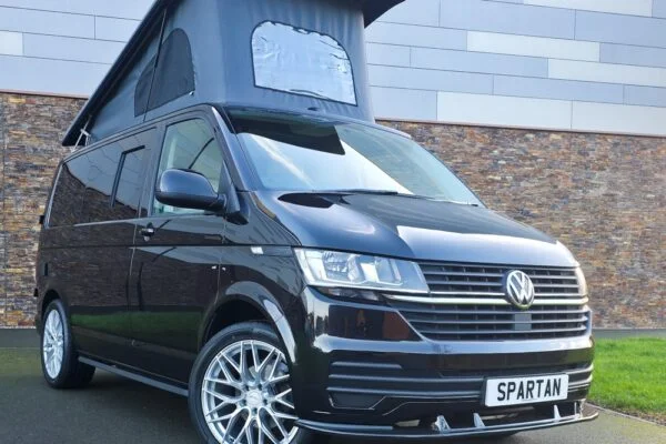 VW T6.1 Transporter campervan in gloss black with a spartan conversion from the front