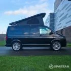 VW T6.1 Transporter campervan in gloss black with a spartan conversion from the side