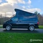 VW T6.1 Transporter campervan in gloss black with a spartan conversion from the side