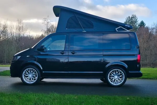 VW T6.1 Transporter campervan in gloss black with a spartan conversion from the side