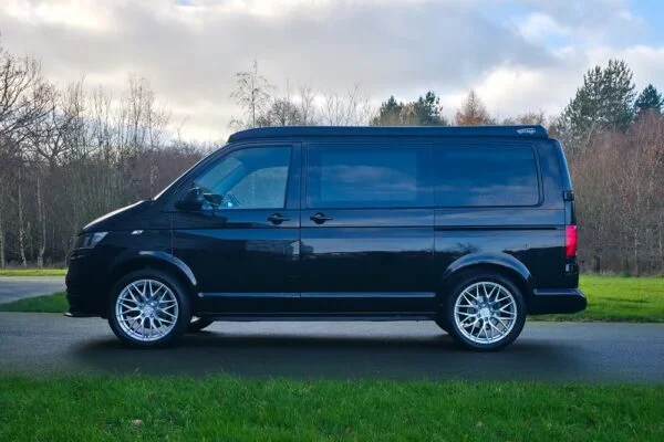 VW T6.1 Transporter campervan in gloss black with a spartan conversion from the side