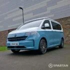 VW Transporter T7 campervan, with full Spartan Campers conversion. Passengers front quarter with pop top down