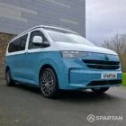 VW Transporter T7 campervan, with full Spartan Campers conversion. Drivers front quarter with pop top down