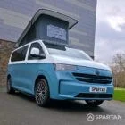 VW Transporter T7 campervan, with full Spartan Campers conversion. Front drivers quarter with pop top up