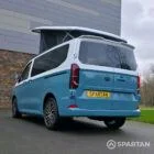 VW Transporter T7 campervan, with full Spartan Campers conversion. Rear passenger quarter with pop top up