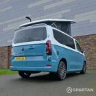 VW Transporter T7 campervan, with full Spartan Campers conversion. Rear drivers quarter with pop top up
