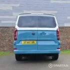 VW Transporter T7 campervan, with full Spartan Campers conversion. Rear with pop top down