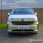VW Transporter T7 campervan with full Spartan Campers conversion in white and military green, front on with the poptop roof down