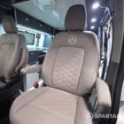 VW T7 Transporter with Spartan campervan conversion. showcasing the passenger captains seat in dust grey facing the front