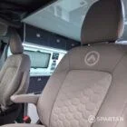 VW T7 Transporter with Spartan campervan conversion. showcasing the passenger captains seat in dust grey upholstery