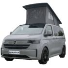 VW Transporter T7 campervan in stone grey with pop-top roof, passenger-side front quarter view.