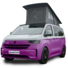 VW Transporter T7 campervan in two tone grape and candy white with pop-top roof, passenger-side front quarter view.