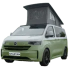 VW Transporter T7 campervan in two tone receeda green with pop-top roof, passenger-side front quarter view.