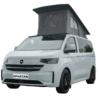 VW Transporter T7 campervan in two tone reflex silver with pop-top roof, passenger-side front quarter view.