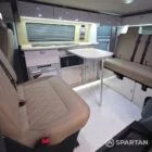 Spartan campers VW campervan conversion with winter floor, latte and Winchester oak kitchen and liquor upholstery. Fitted with a removable table