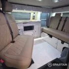 Spartan campers VW campervan conversion with winter floor, latte and Winchester oak kitchen and liquor upholstery. With a full kitchen and sleeping area