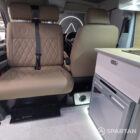 Spartan campers VW campervan conversion with winter floor, latte and Winchester oak kitchen and liquor upholstery. Fitted with a swivel and slide passenger bench seat