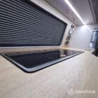 Spartan campers VW campervan conversion with winter floor, latte and Winchester oak kitchen and liquor upholstery. Fitted with a large kitchen worktop