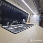 Spartan campers VW campervan conversion with winter floor, latte and Winchester oak kitchen and liquor upholstery. Fitted with a sink
