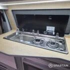 Spartan campers VW campervan conversion with winter floor, latte and Winchester oak kitchen and liquor upholstery. Fitted with a gas hob and sink