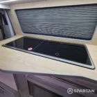 Spartan campers VW campervan conversion with winter floor, latte and Winchester oak kitchen and liquor upholstery. Fitted with a sink and double gas hob