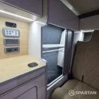Spartan campers VW campervan conversion with winter floor, latte and Winchester oak kitchen and liquor upholstery. Fitted with a full length wardrobe