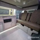 Spartan campers VW campervan conversion with winter floor, latte and Winchester oak kitchen and liquor upholstery. Fitted with a rock and roll bed