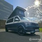 Spartan Campers VWT6 long wheel base campervan in bamboo and candy white. front drivers quarter with roof up