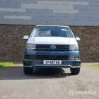 Spartan Campers VWT6 long wheel base campervan in bamboo and candy white. front straight on with roof down