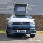 Spartan Campers VWT6 long wheel base campervan in bamboo and candy white. front straight on with roof up