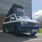 Spartan Campers VWT6 long wheel base campervan in bamboo and candy white. front drivers quarter with roof up