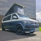 Spartan Campers VWT6 long wheel base campervan in bamboo and candy white. front drivers quarter with roof up