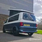 Spartan Campers VWT6 long wheel base campervan in bamboo and candy white. rear passenger quarter with roof up
