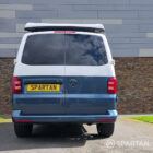 Spartan Campers VWT6 long wheel base campervan in bamboo and candy white. rear quarter with roof down